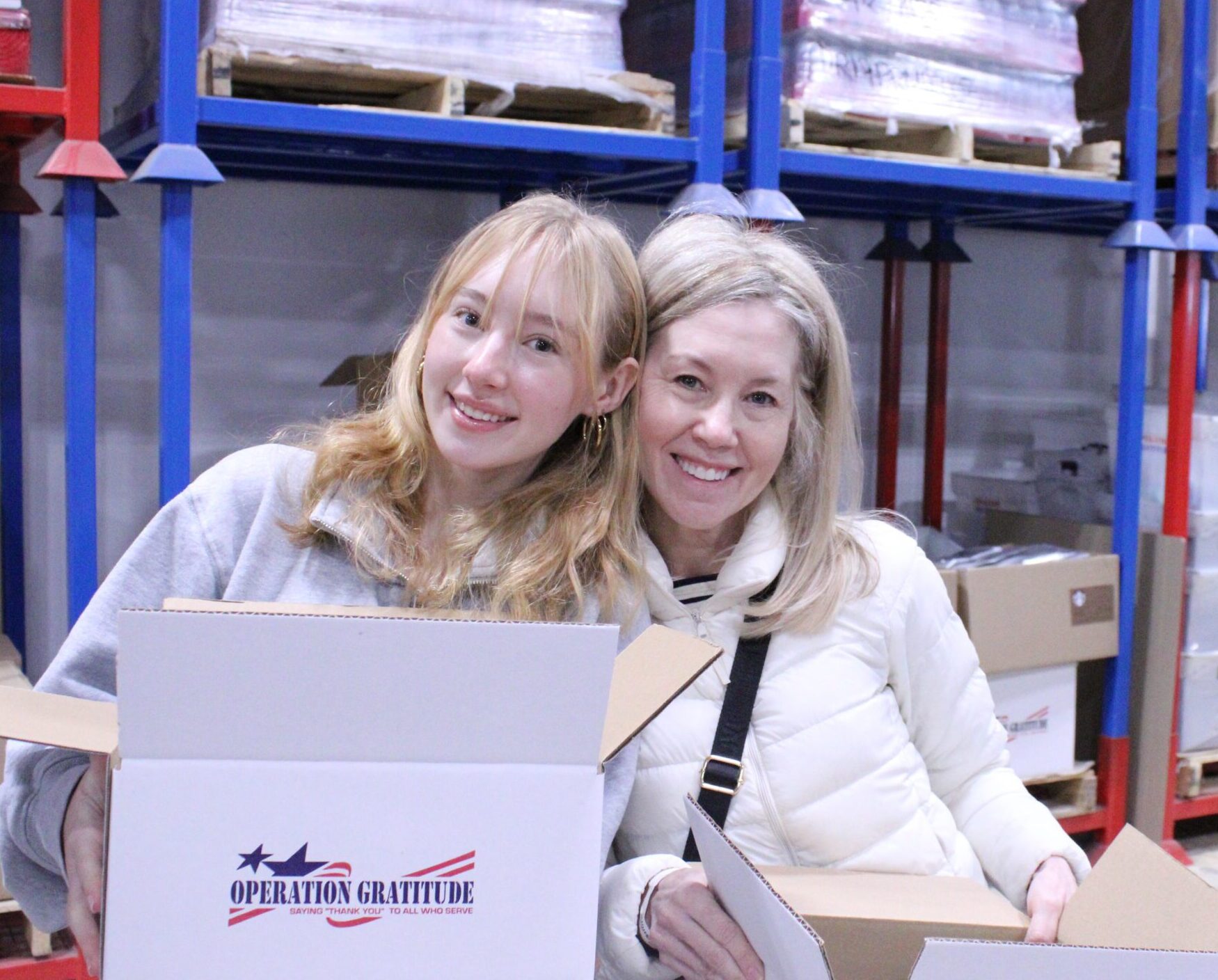 Mother and daughter volunteering together at an Assembly Day